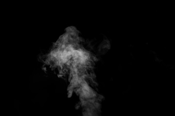 Curly white steam rising up and splashing water scattering in different directions isolated on a black background. Can be used as background, design element
