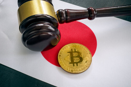 Cryptocurrency regulations in Japan. Flag, gavel and coin.