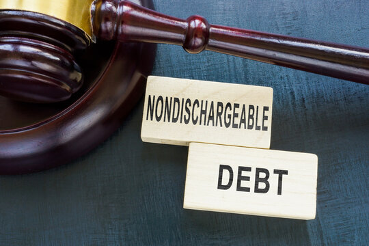 Gavel and words Nondischargeable Debt on the cubes.