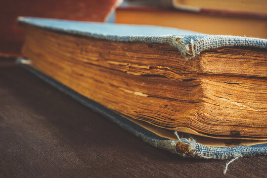Close-up of an old book with yellowed paper.