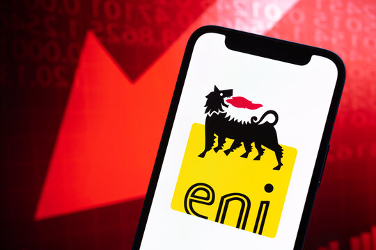 ENI italy oil prices, logo close-up. Collapse, petroleum crisis, red arrow down on stock market graphs background photo