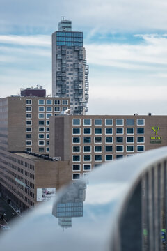 Tilburg city architecture with water reflection.