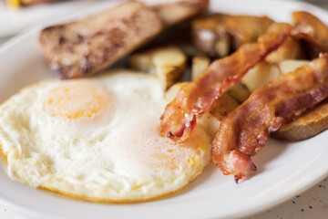Delicious Morning Breakfast Plate of Eggs, Bacon and Sausage.
