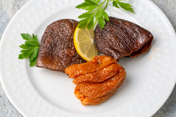 Dried eggplant stuffed and dried pepper stuffed with rice, tomato and olive oil known as dolma. (Turkish name; kuru biber dolmasi, kuru patlican dolmasi)