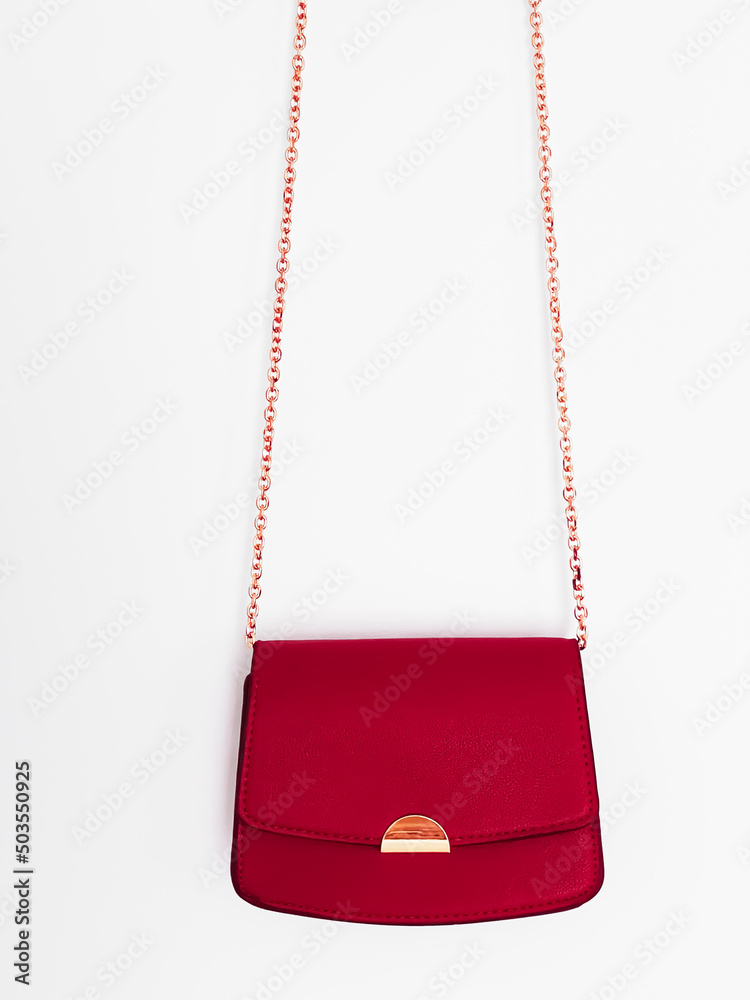 Wall mural red fashionable leather purse with gold details as designer bag and stylish accessory, female fashio