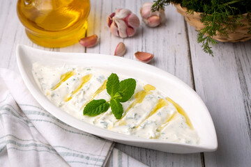 Haydari is a type of yogurt made from certain herbs and spices, combined with garlic. Turkish cuisine.
