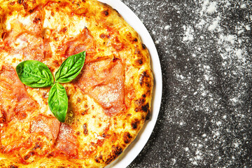 Hot tasty traditional italian pizza with ham.