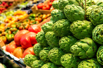 Vegetable market. Stall with artichokes and other vegetables