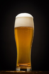 glass of beer on dark background