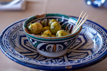 Olives in a pretty dish