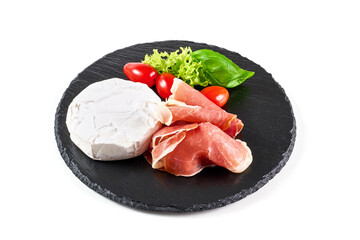 Camembert cheese with jerked jamon, antipasto snacks, isolated on white background.