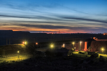 Evening panorama of the railway bridge and the city