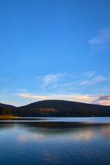 beautiful lake in late sun with mountains in the background and blue sky in el oro de hidalgo state of mexico 