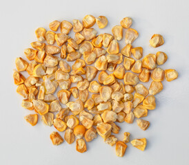 Corn seeds on a white background. Close-up.
