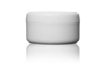 mockup of white plastic cosmetic jar for face cream on white isolated background with reflection 