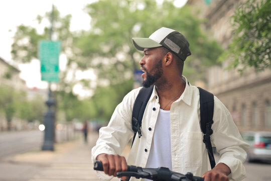 portrait of young man on scooter