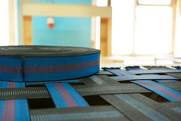 Elastic band for furniture production industry on a sofa. Furniture is ready for upholstery....