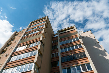 Modern multi-storey building in the center of Moscow on the background of clouds. Beautiful tall building in a Russian city