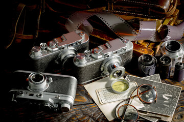 Old camera on wooden background