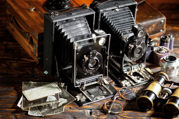 Old vintage cameras on an old background.