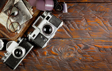 Old camera in the studio on an old background