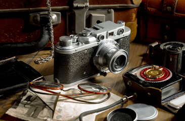 Old camera in the studio on an old background