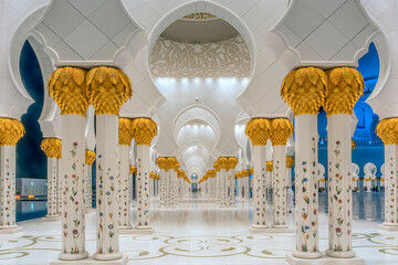 Detailed exterior photo of an illuminated external hallway of the Sheik Zayed Mosque in Abu Dhabi,...