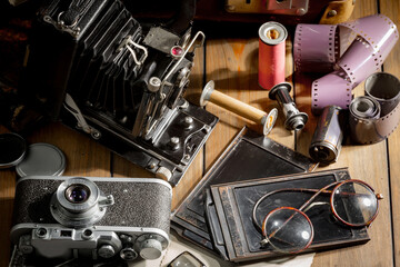 Old vintage cameras on an old background.