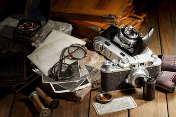 Old camera on wooden background