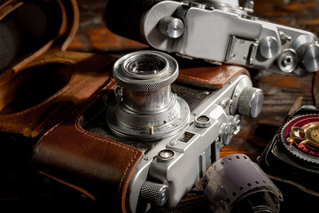 Old vintage photo cameras on an old background.