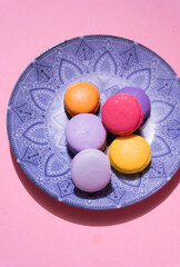 Multi-colored pasta on a multi-colored bright background. Place for text