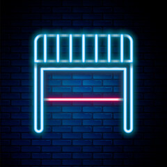 Glowing neon line Football goal icon isolated on brick wall background. Colorful outline concept. Vector