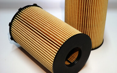 Automotive filters used in the maintenance of a modern car close-up. Selected focus.