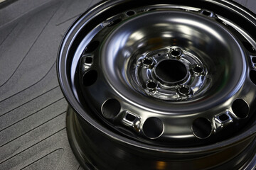 Wheel disk in black color for a modern car close-up. Selected focus.