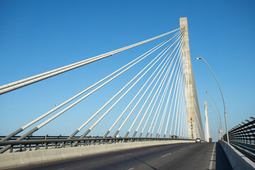 Fototapeta na wymiar Barranquilla, Atlantico, Colombia. January 15, 2022: Pumarejo bridge with blue sky in the city.