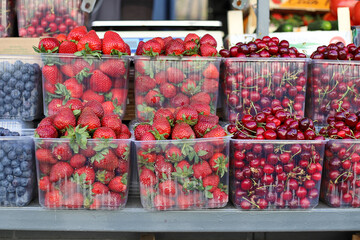 retail street trade of strawberries and cherries from the counter