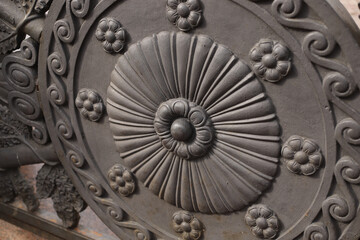 fragment of the pattern of an ancient metal gate in a classic style