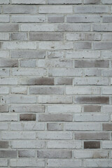 brick stone wall background, grey and bright brick layer in vertical format, smooth surface 