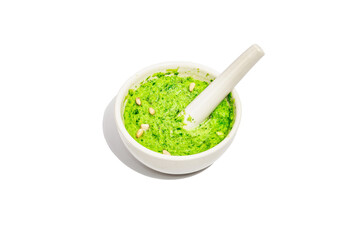 Ramson pesto with olive oil, parmesan, and pine nuts isolated on white background