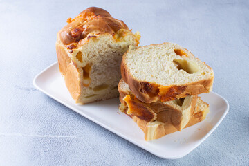 3 cheese braid bread, mozzarella, cheese, yellow cheese displayed on gray background