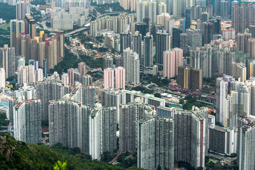 View of the Kowloon walled city from Lion Rock hill under a stormy cloudy sky in Hong Kong, China