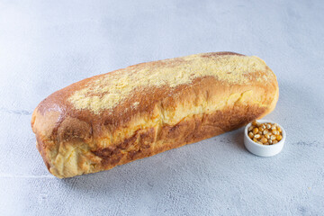 Corn and cheese bread, displayed on gray background