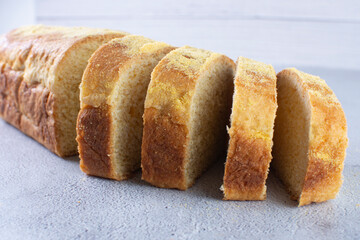 Corn and cheese bread, displayed on gray background
