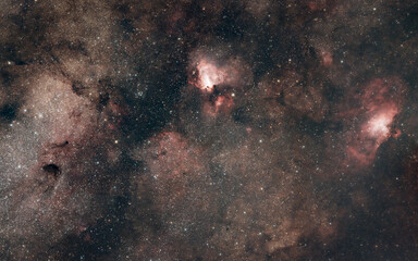 Mosaic comprising (left to right) the Small Sagittarius Star Cloud and the Omega (M17) and Eagle (M16) Nebulae. Taken from Christchurch, New Zealand, July 2021. (4.5h @ 400mm f/2.)