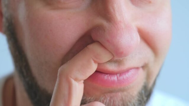 Adult Caucasian Male Picking Nose with Index Finger