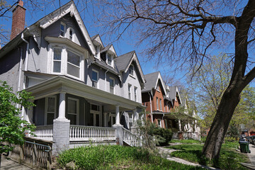 Residential street with traditional old houses with front porch and gable