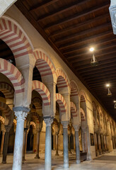 Medieval moorish architecture, colorful achways with columns in old mosque in Cordoba with no people, Andalusia, Spain