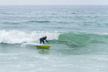 Surfer riding waves