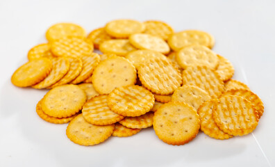 Crunchy snacks, bunch of cracker biscuits over white background.