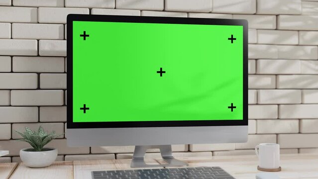 Empty desktop computer Mock-Up on work desk with decoration. Selective focus on  screen. Green screen for banner and logo. Animation, 3D Render.